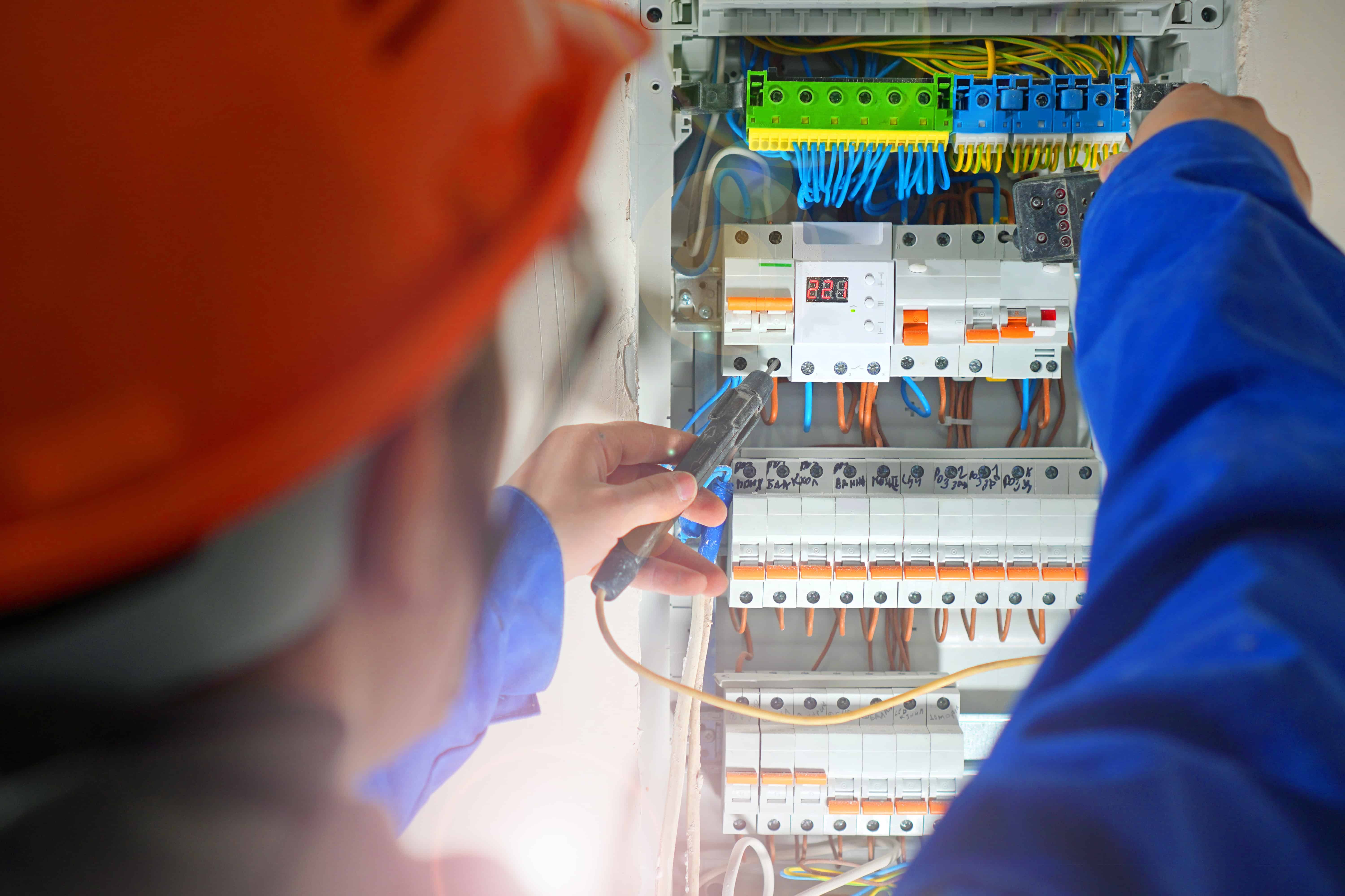 Electrician in ontario reviewing a electrical panel board for upgrading